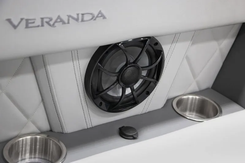 Slide: The Image of Veranda Vertex 22RC 2025 interior speaker with cup holders and quilted upholstery. - 8