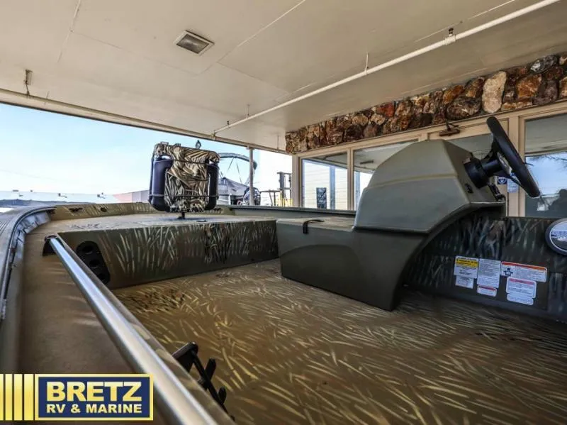 Slide: The Image of 2025 Grizzly 1754 SC boat interior at Bretz RV & Marine showroom. - 11