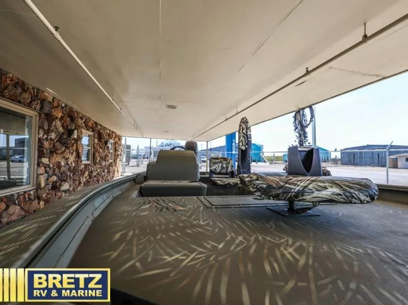 Slide: The Image of 2025 Grizzly 1754 SC boat under shelter at Bretz RV & Marine dealership. - 16