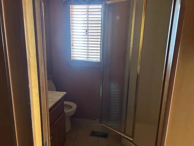 Slide: The Image of Bathroom interior of 2007 Lakeview houseboat with shower, toilet, and window blinds. - 12
