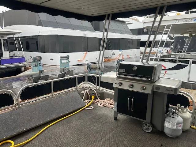 Slide: The Image of Outdoor deck of 2007 Lakeview houseboat with grill and marina view. - 3