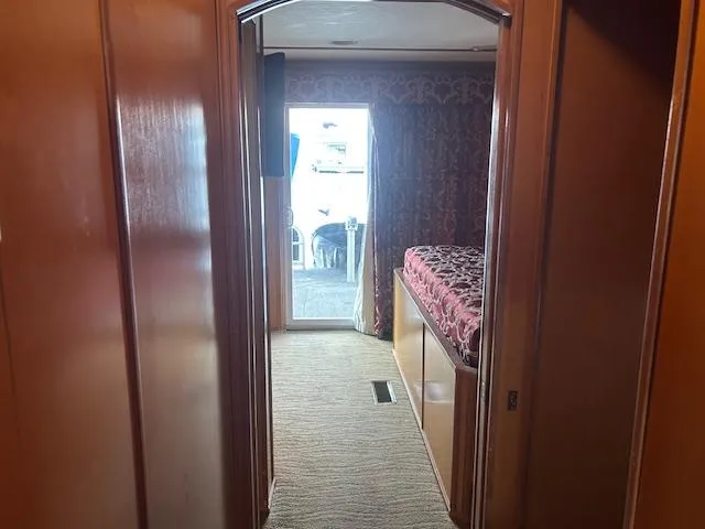 Slide: The Image of Interior hallway of 2007 Lakeview houseboat with carpet and wooden paneling. - 9