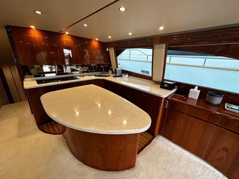 Slide: The Image of Luxurious kitchen interior of 2018 Viking 62 Enclosed Bridge yacht with modern amenities. - 19
