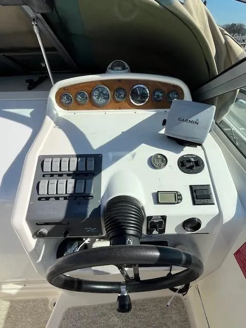 Slide: The Image of 1996 Sea Ray 270 Sundancer helm with Garmin navigation system and instrument panel. - 12
