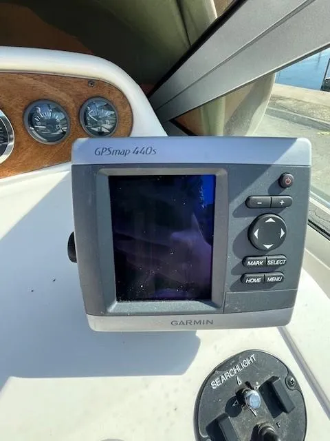 Slide: The Image of Garmin GPSmap 440s on 1996 Sea Ray 270 Sundancer dashboard, with searchlight control. - 20