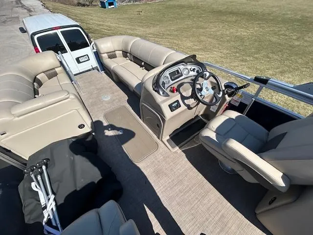 Slide: The Image of 2022 Sun Tracker Party Barge 22 XP3 interior with seating and steering console. - 9