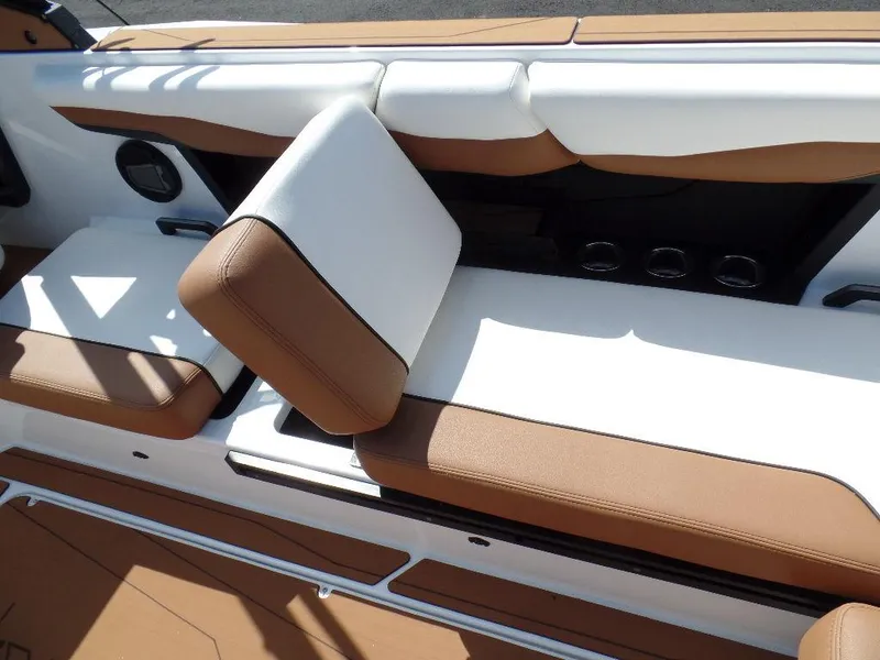 Slide: The Image of 2024 Axis T250 boat interior with brown and white seating. - 11