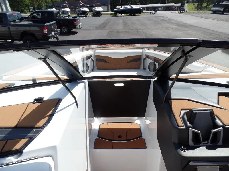 Slide: The Image of 2024 Axis T250 boat interior with sleek design and modern dashboard. - 17