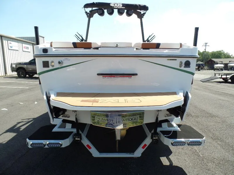 Slide: The Image of 2024 Axis T250 boat rear view with swim platform and wakeboard tower. - 3