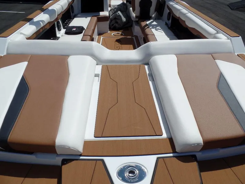 Slide: The Image of 2024 Axis T250 boat interior with brown and white seating and sleek design. - 4