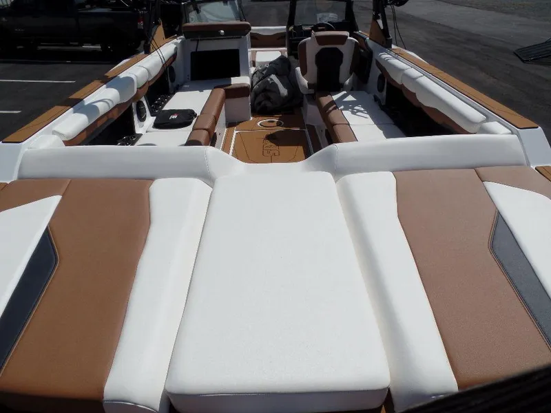 Slide: The Image of 2024 Axis T250 boat interior with brown and white seating, spacious layout. - 5
