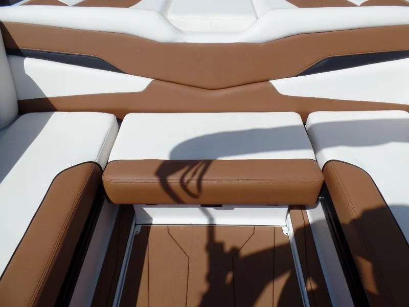 Slide: The Image of 2024 Axis T250 boat interior with brown and white seating. - 9