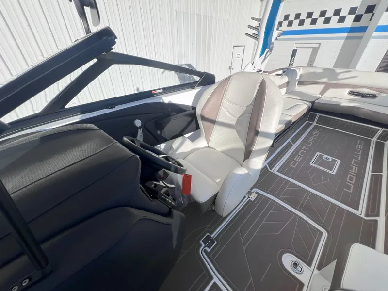 Slide: The Image of 2022 Centurion Fi25 boat interior with sleek seating and modern dashboard design. - 12