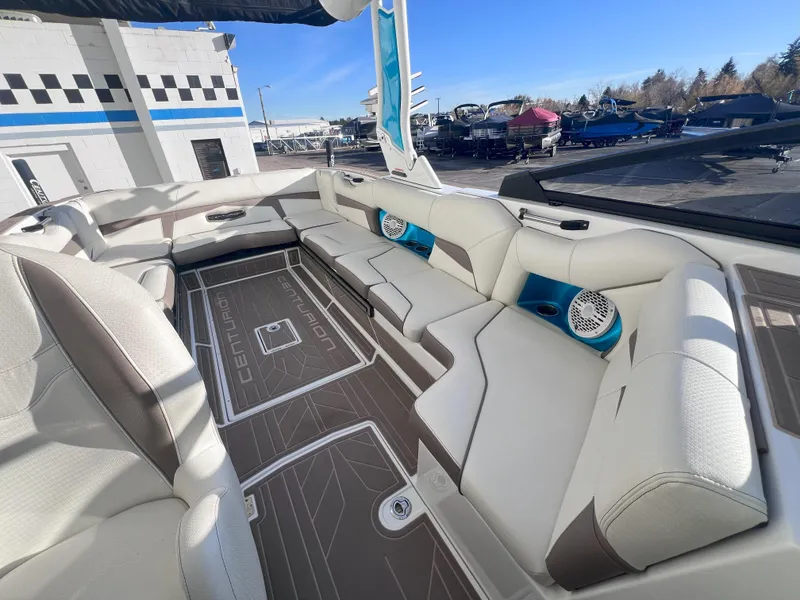 Slide: The Image of 2022 Centurion Fi25 boat interior with spacious seating and modern design. - 13