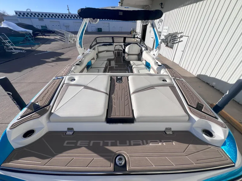 Slide: The Image of 2022 Centurion Fi25 boat with spacious seating and sleek design. - 8