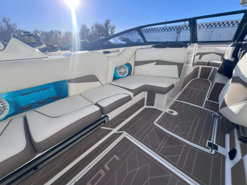 Slide: The Image of 2022 Centurion Fi25 boat interior with modern seating and stylish flooring. - 9