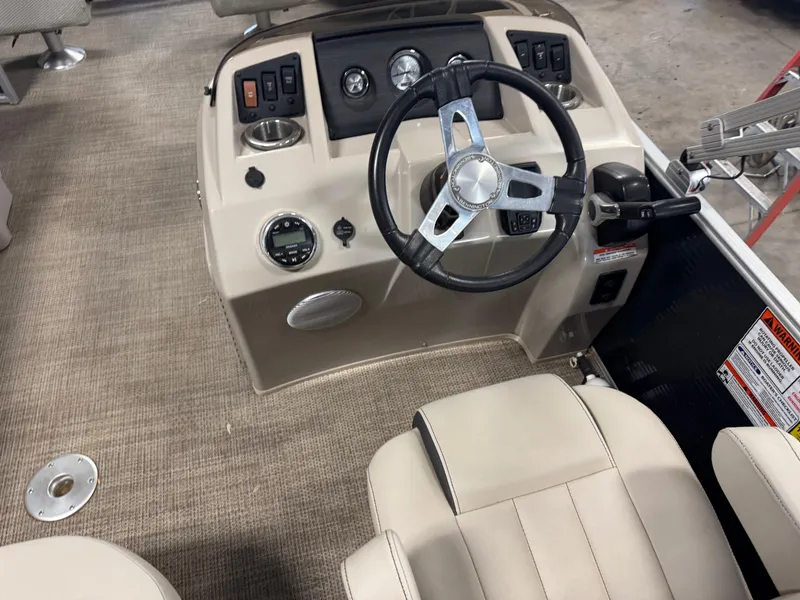 Slide: The Image of 2020 Bennington SX 22 SSRX boat interior with steering wheel and control panel. - 10