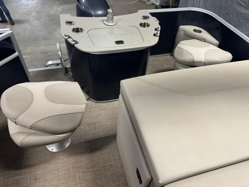 Slide: The Image of 2020 Bennington SX 22 SSRX boat interior with beige seating and helm station. - 11