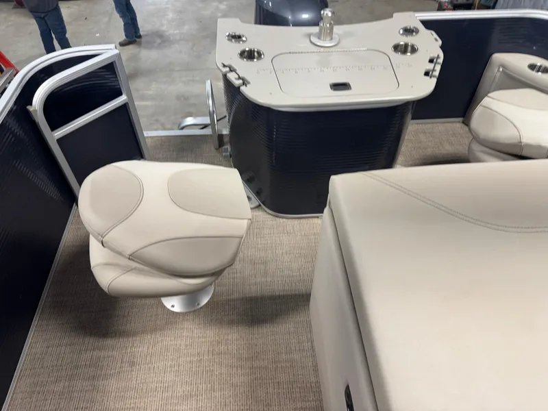 Slide: The Image of Interior of 2020 Bennington SX 22 SSRX pontoon boat with beige seating and helm. - 12