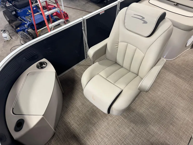 Slide: The Image of 2020 Bennington SX 22 SSRX boat interior with beige captain's chair and cup holder. - 16