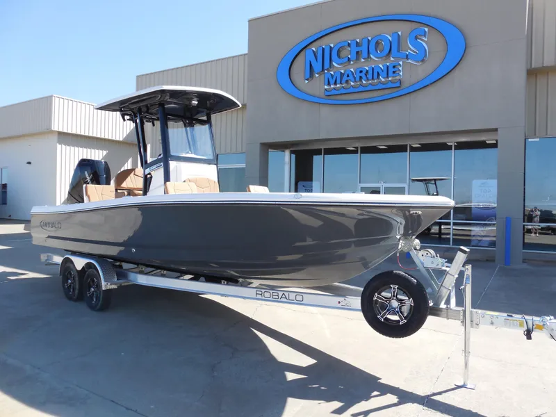 Slide: The Image of 2025 Robalo 246 Cayman boat on trailer at Nichols Marine dealership. - 2