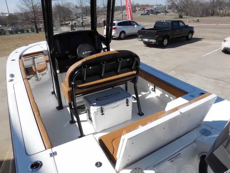 Slide: The Image of 2025 Robalo 246 Cayman boat interior with seating and storage compartments. - 5