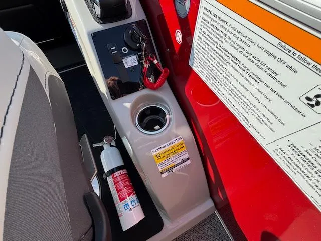 Slide: The Image of 2025 Barletta Cabrio 22QC boat console with fire extinguisher and safety instructions. - 12