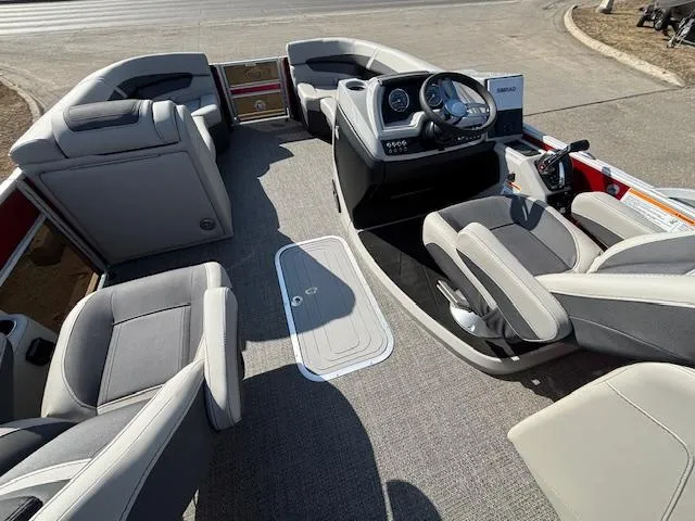 Slide: The Image of 2025 Barletta Cabrio 22QC pontoon boat interior with modern seating and steering console. - 14
