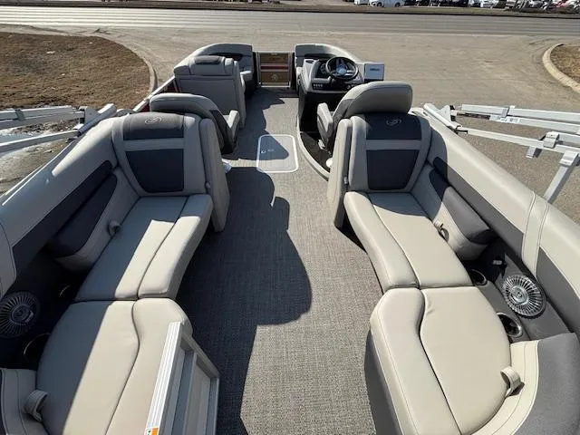 Slide: The Image of 2025 Barletta Cabrio 22QC pontoon boat with spacious seating and modern interior design. - 16