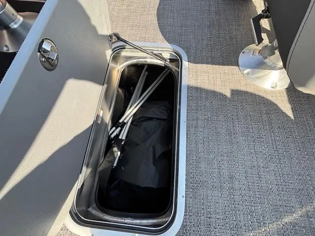 Slide: The Image of Storage compartment in 2025 Barletta Cabrio 22QC boat, featuring interior equipment. - 19