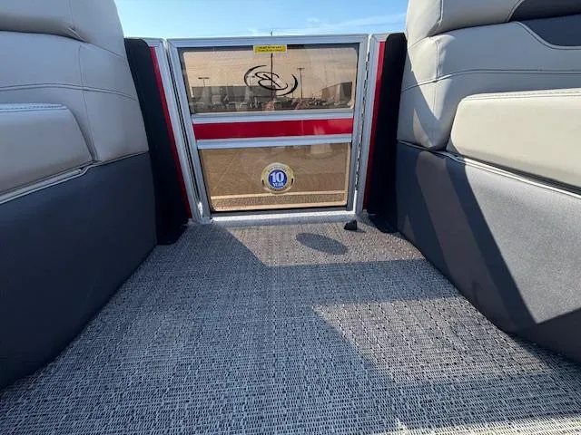 Slide: The Image of Interior view of 2025 Barletta Cabrio 22QC boat with comfortable seating and carpeted flooring. - 2