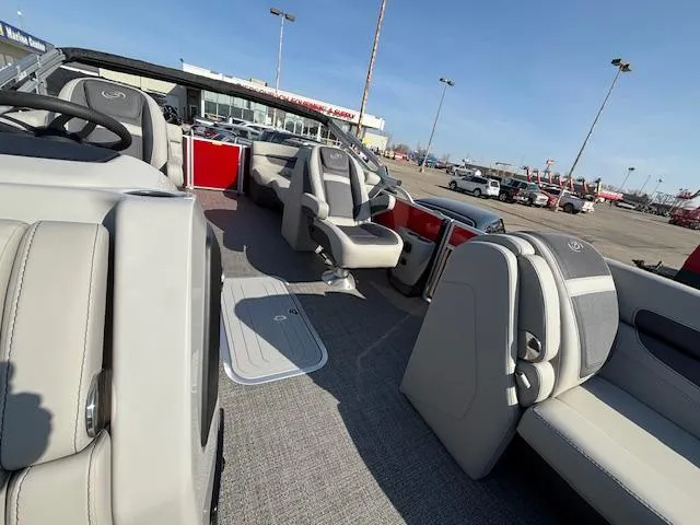 Slide: The Image of 2025 Barletta Cabrio 22QC pontoon boat interior with gray seating and modern design. - 23