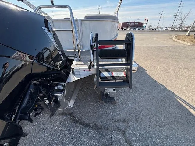 Slide: The Image of 2025 Barletta Cabrio 22QC boat with motor and boarding ladder on display. - 25