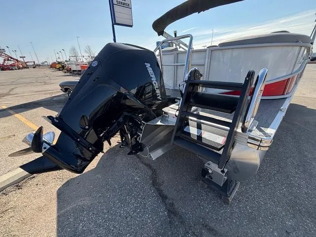 Slide: The Image of 2025 Barletta Cabrio 22QC pontoon boat with Mercury outboard motor and boarding ladder. - 27