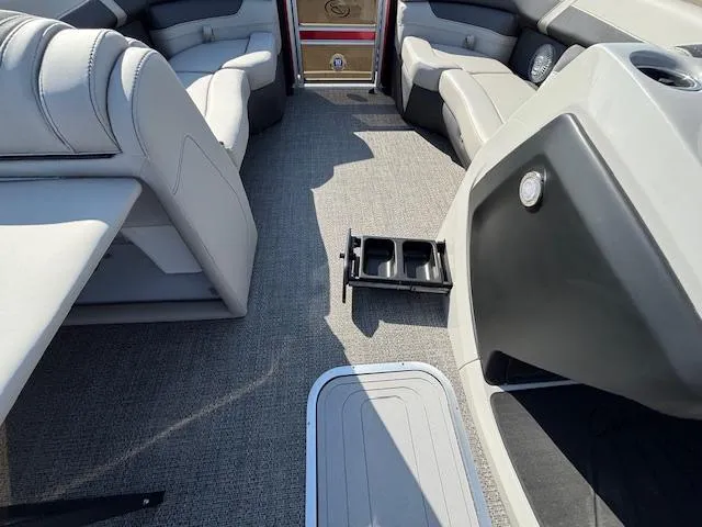 Slide: The Image of 2025 Barletta Cabrio 22QC interior with gray seating and carpeted flooring. - 5