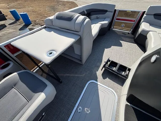 Slide: The Image of 2025 Barletta Cabrio 22QC interior with seating, table, and storage compartments. - 6