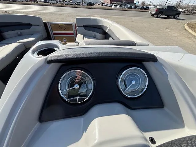 Slide: The Image of 2025 Barletta Cabrio 22QC dashboard with gauges and cup holder. - 9