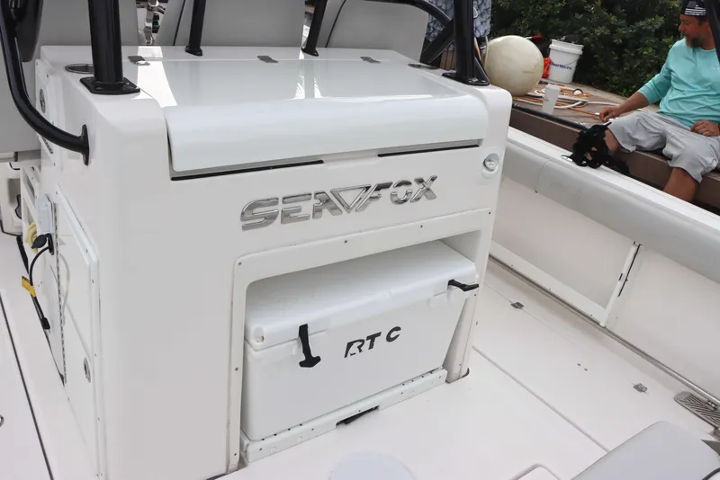 Slide: The Image of 2023 Sea Fox 328 Commander boat interior with cooler and seating area. - 13