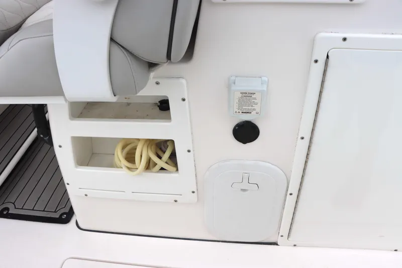 Slide: The Image of 2023 Sea Fox 328 Commander boat interior with storage compartments and seating. - 15