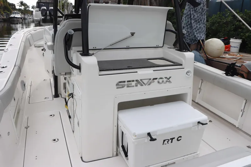 Slide: The Image of 2023 Sea Fox 328 Commander boat interior with seating and storage compartments. - 20
