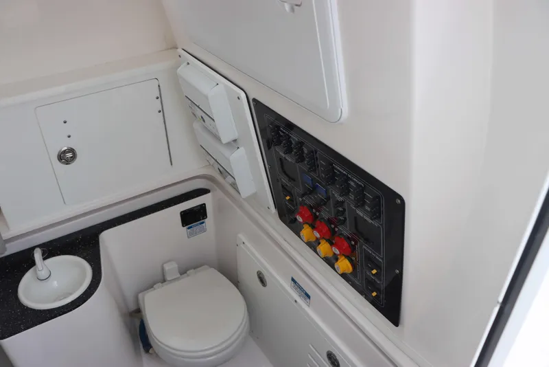 Slide: The Image of 2023 Sea Fox 328 Commander boat interior with toilet and control panel. - 21