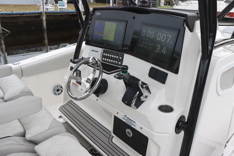 Slide: The Image of 2023 Sea Fox 328 Commander boat dashboard with modern controls and navigation screens. - 29
