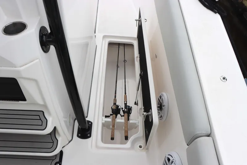 Slide: The Image of 2023 Sea Fox 328 Commander fishing rod storage compartment with rods. - 32