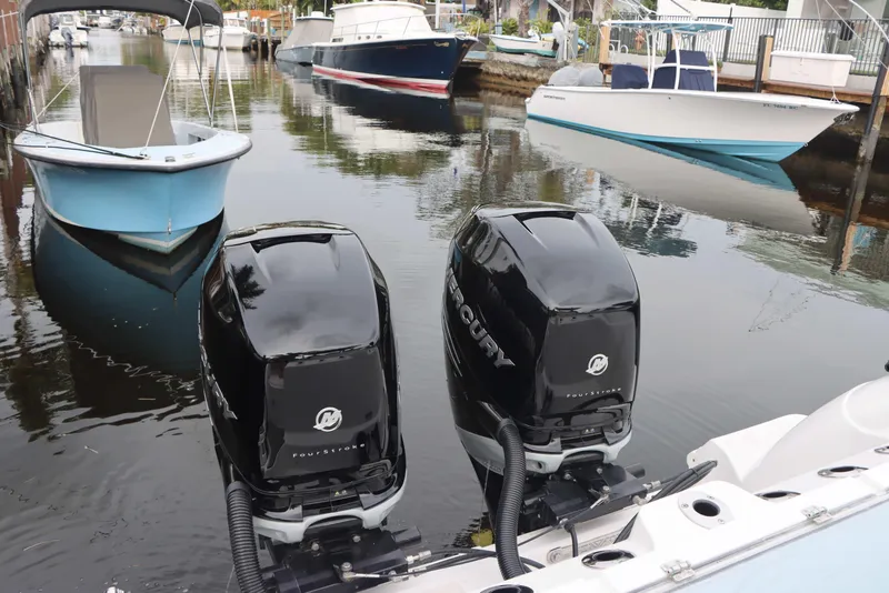 Slide: The Image of 2023 Sea Fox 328 Commander with twin Mercury outboard engines docked in a canal. - 36