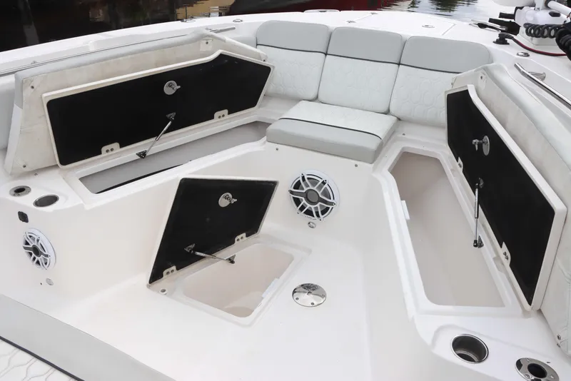 Slide: The Image of 2023 Sea Fox 328 Commander boat interior with open storage compartments and seating. - 5