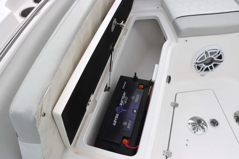 Slide: The Image of 2023 Sea Fox 328 Commander boat battery compartment with storage and speaker. - 6