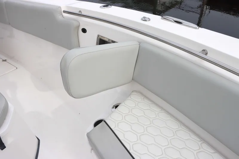 Slide: The Image of 2023 Sea Fox 328 Commander boat interior with cushioned seating and sleek design. - 7
