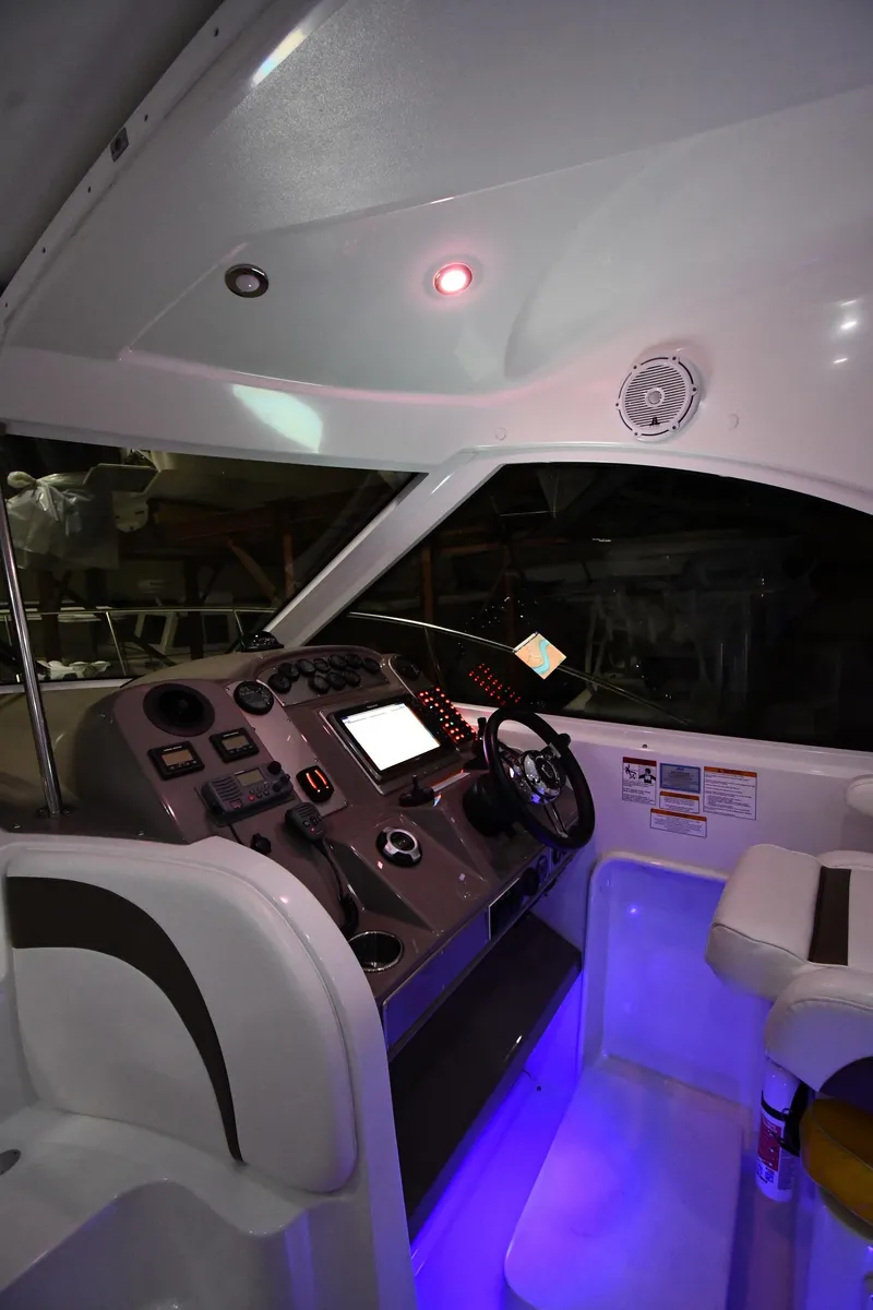 Slide: The Image of 2012 Cruisers Yachts 390 Sports Coupe helm with illuminated controls and seating. - 10