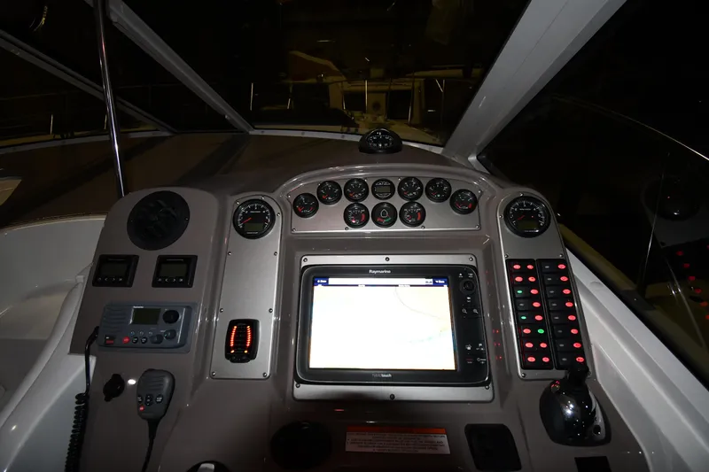 Slide: The Image of 2012 Cruisers Yachts 390 Sports Coupe dashboard with navigation system and control panel. - 11