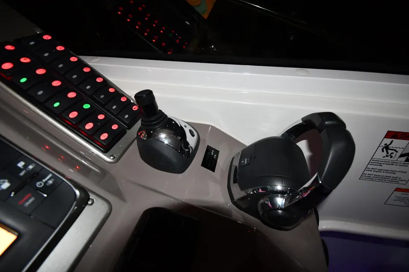 Slide: The Image of Control panel of 2012 Cruisers Yachts 390 Sports Coupe with joystick and steering wheel. - 12